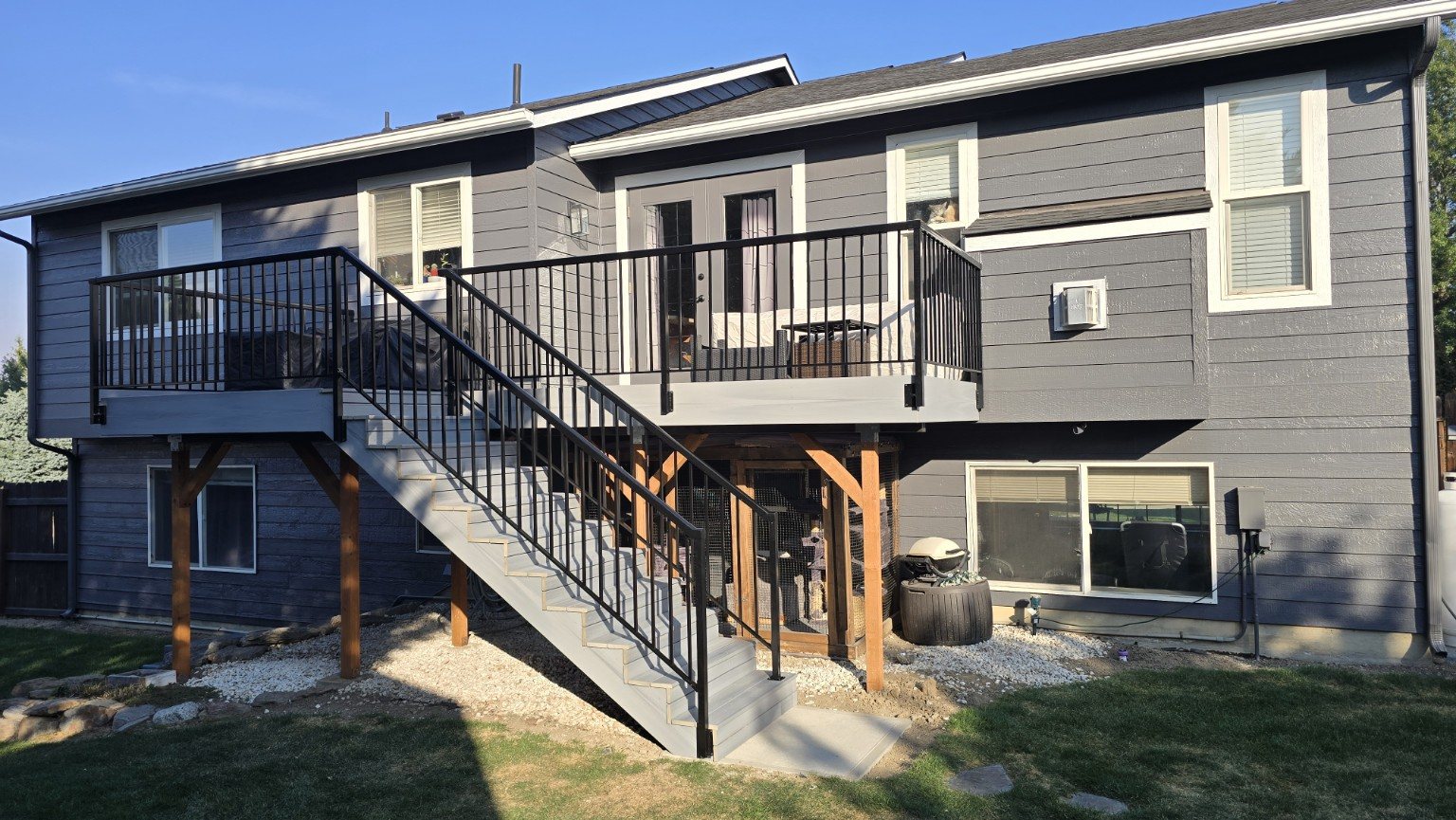 Finished deck rebuild with black aluminum railing